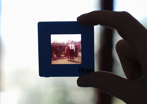 person holding square black photo frame