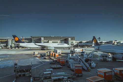 photo of white airliner on port