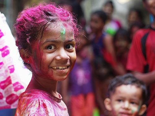 selective focus photo of girl in shirt smiling