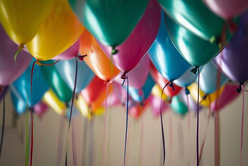 selective focus photography of assorted-color balloons