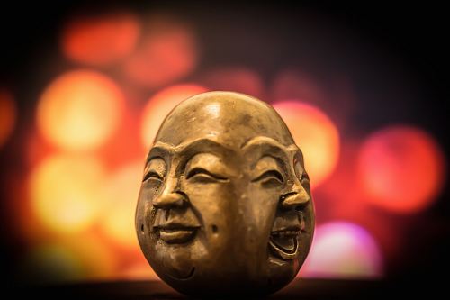 selective focus photography of buddha bust decor