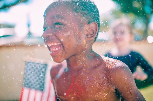 topless boy smiling