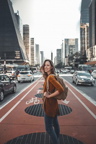 woman standing on middle of road