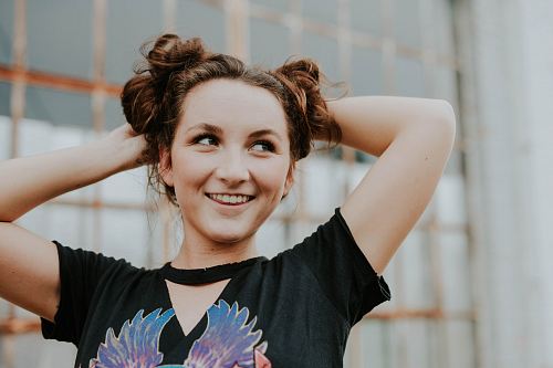 woman wearing black V-neck T-shirt during daytime