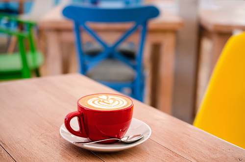 drink red espresso mug with white sauce on top wooden table beverage