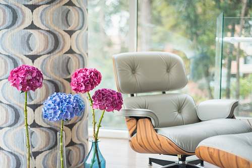 chair pink-and-blue flowers beside armchair flower