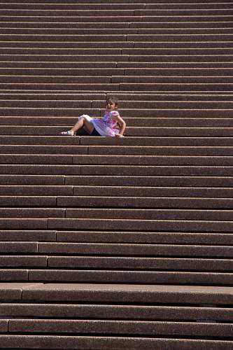 person girl in purple dress sitting on stairs apparel