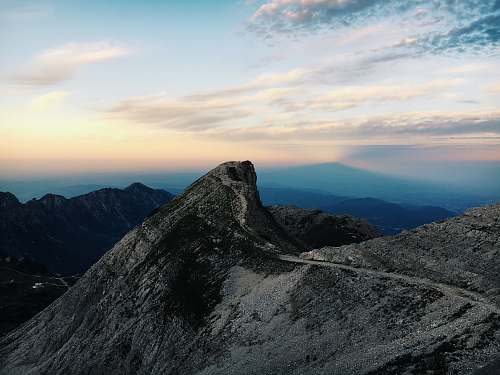 mountain aerial photography of mountain range during golden hour crest