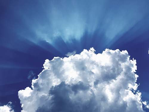 sky sun rays through white cumulus clouds cloud
