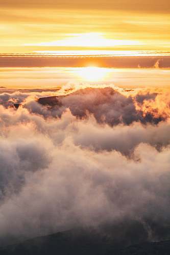 cloud mountain covered in clouds during golden hour nature