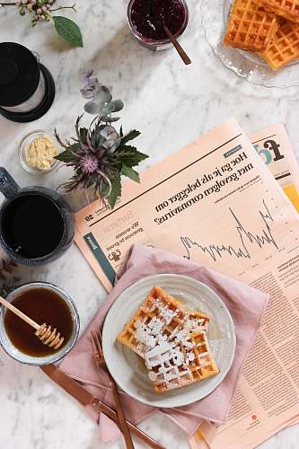 news white ceramic mug on white ceramic saucer food