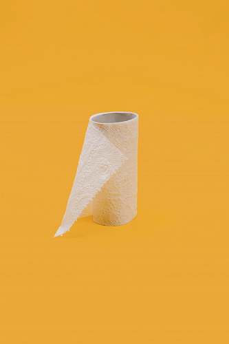 pandemic white tissue paper roll on yellow surface quarantine