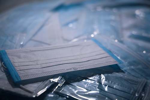 grey blue textile on clear plastic pack facemask