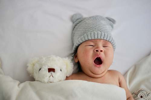 human baby's gray knit hat person