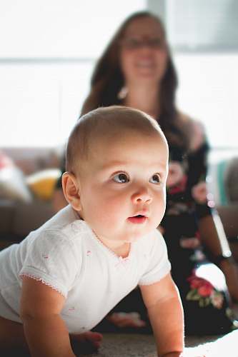 person crawling baby on floor human
