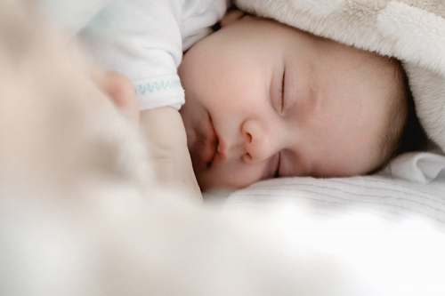human selective focus photography of sleeping baby sleeping