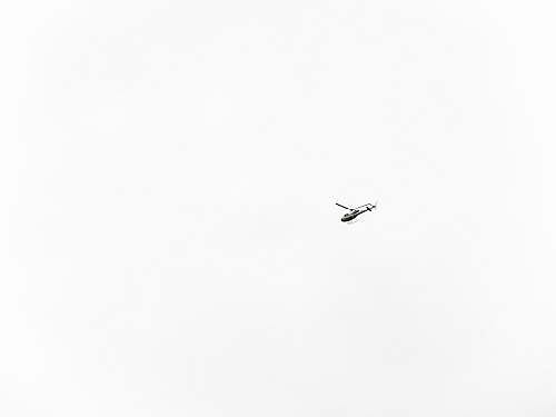 white flying helicopter helicopter