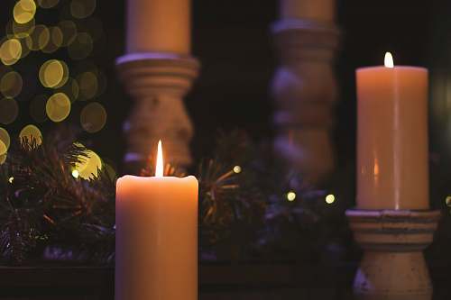 fire lighted pillar candles christmas