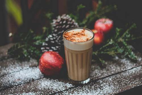 winter latte field cup beside red apple apple