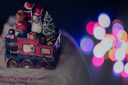 ornament shallow focus photo fo red, blue, and green train figurine festive
