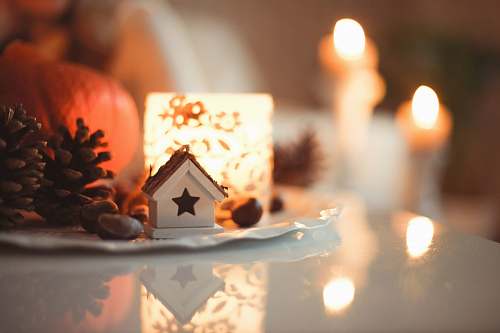winter white ceramic house miniature on top of table holiday