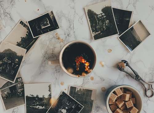 photos assorted grayscale photos near white ceramic mug sugar