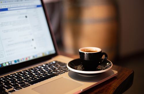 cup of coffee on laptop
