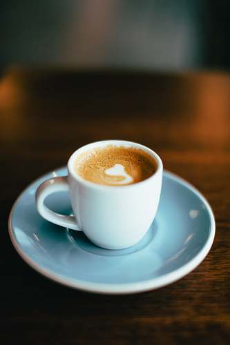 coffee selective focus photography of latte in teacup coffee cup