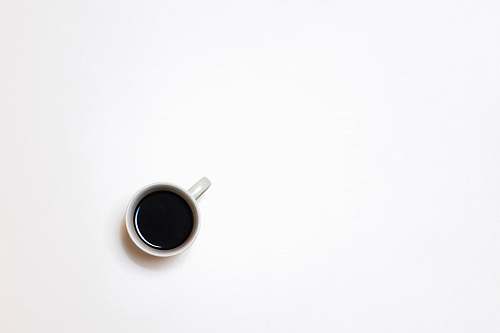 coffee top view photography of mug with black liquid minimal