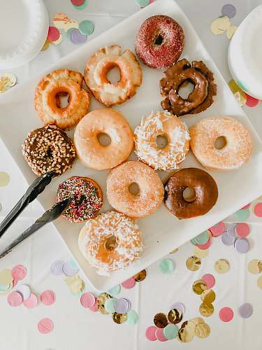 confectionery assorted doughnuts on white ceramic tray sweets