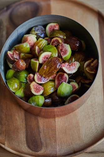 fruit bowl of sliced fruits fig
