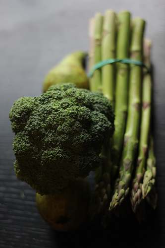 plant broccoli and asparagus on a table broccoli