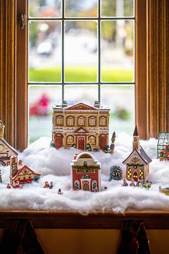 biscuit ceramic Christmas village displayed by the window cookie
