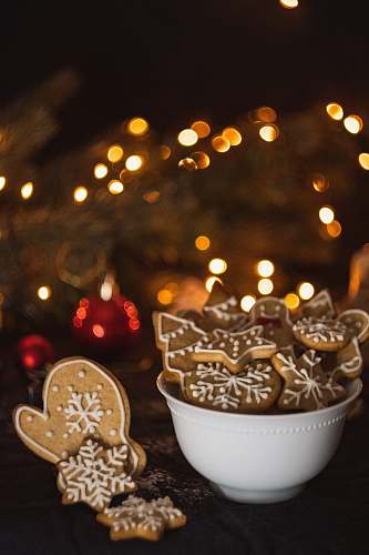 sweets cookies in bowl near Christmas tree confectionery