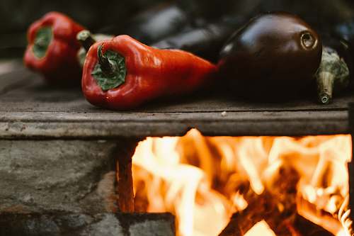 vegetable fire roasting eggplant and chili pepper fire