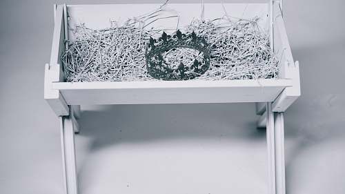 christmas grayscale photo of crown in bassinet ice