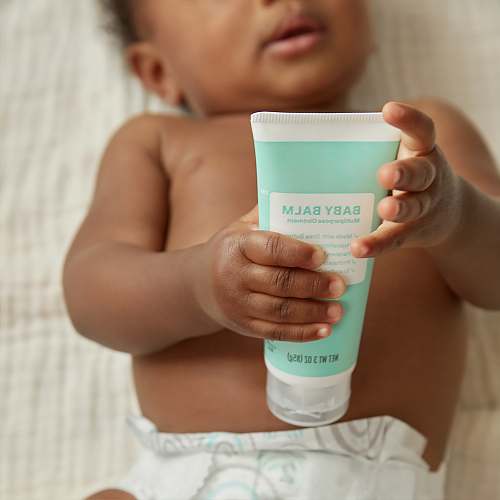 person baby's white plastic bottle toddler