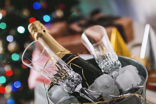 year champagne bottle and glass in bucket glass