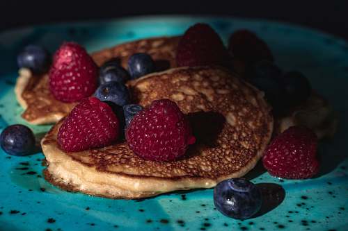 blueberry pancakes with raspberries and blueberries fruit