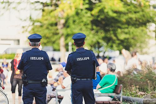 shallow focus photography of police