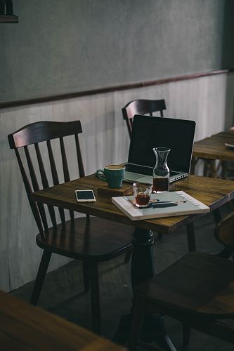 teal ceramic mug on brown wooden table