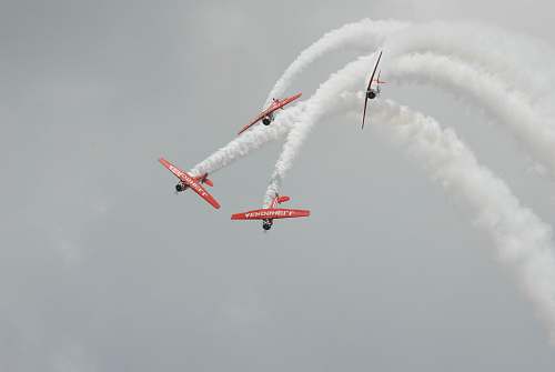 airplane four red biplanes air exhibition aircraft
