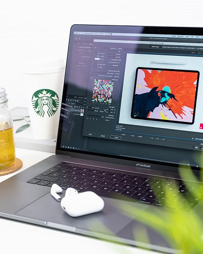 turned on MacBook Pro displaying music