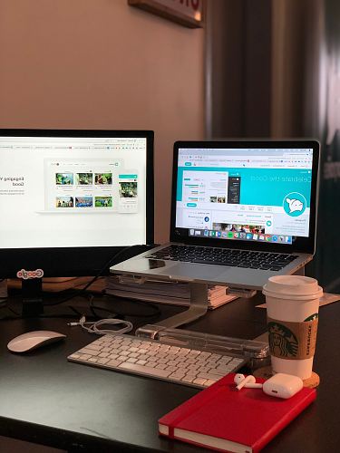 turned on MacBook Pro near Starbucks cup