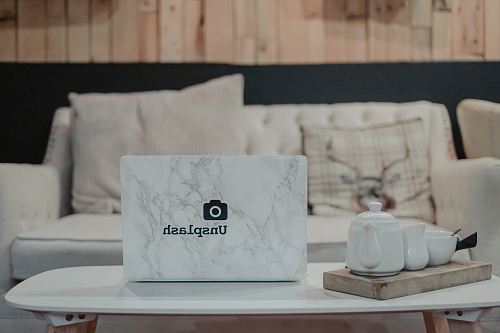 white teapot on white table