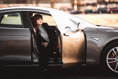 woman sitting inside vehicle