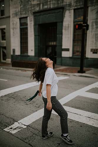 tarmac woman standing on road's pedestrian lane road