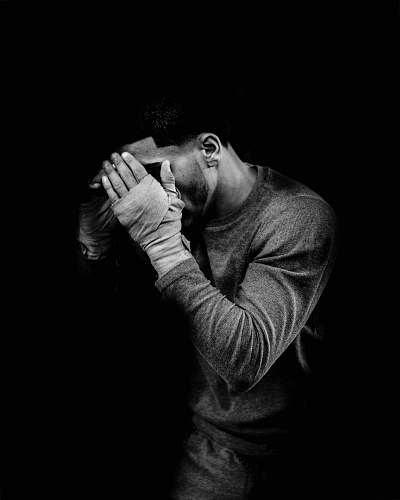 people grayscale photo of male boxer human