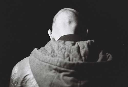 baby grayscale photography of person wearing jacket human