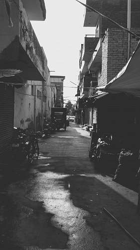 city grayscale photography of hallway black-and-white